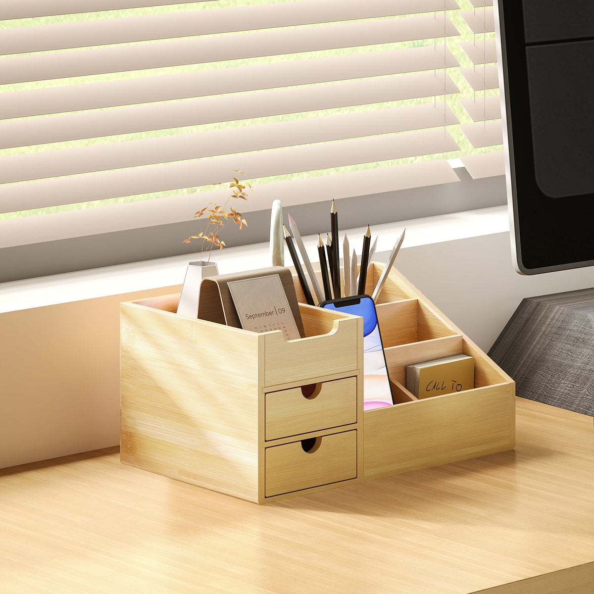 Bamboo desk organiser holding pens and stationery on a desk