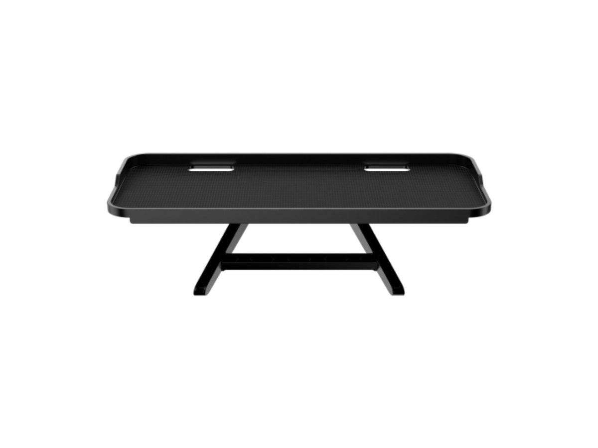 Black clip-on shelf on top of a monitor