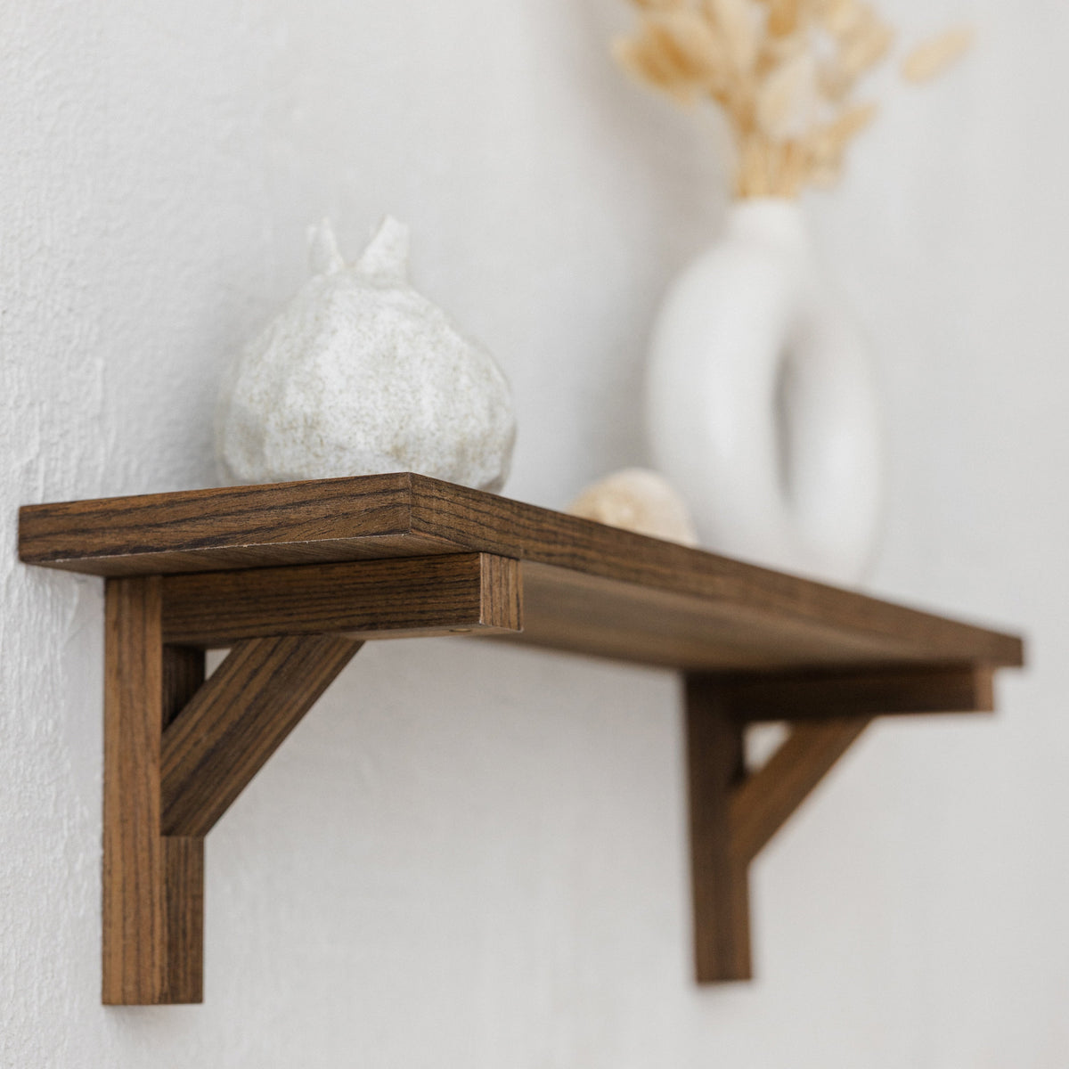Walnut floating shelf with hidden wooden brackets, 60cm