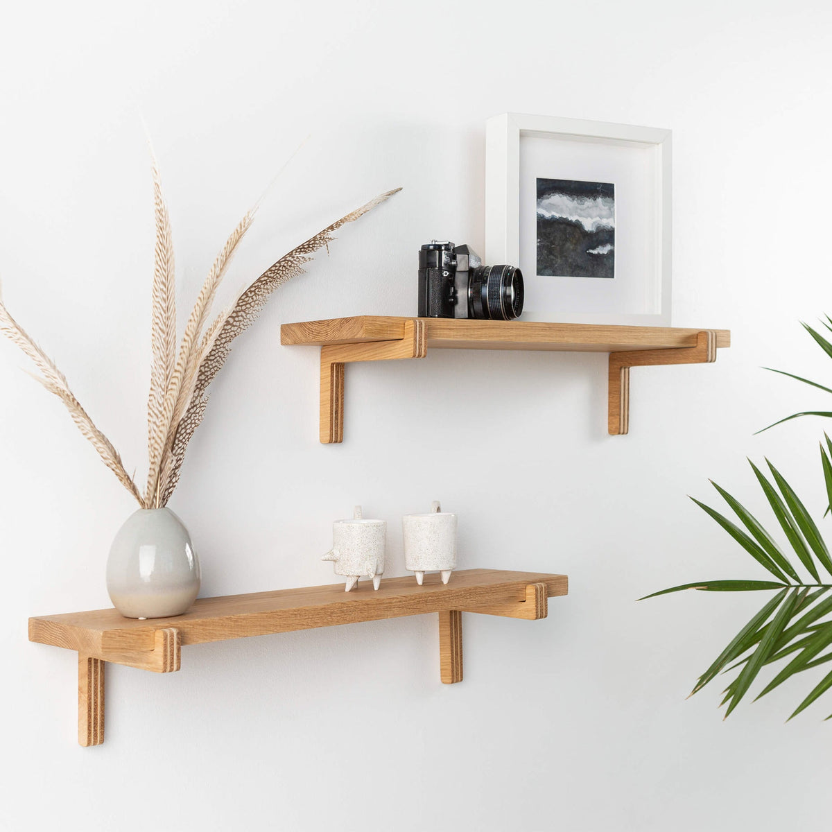 Oak floating wall shelves with wooden holders